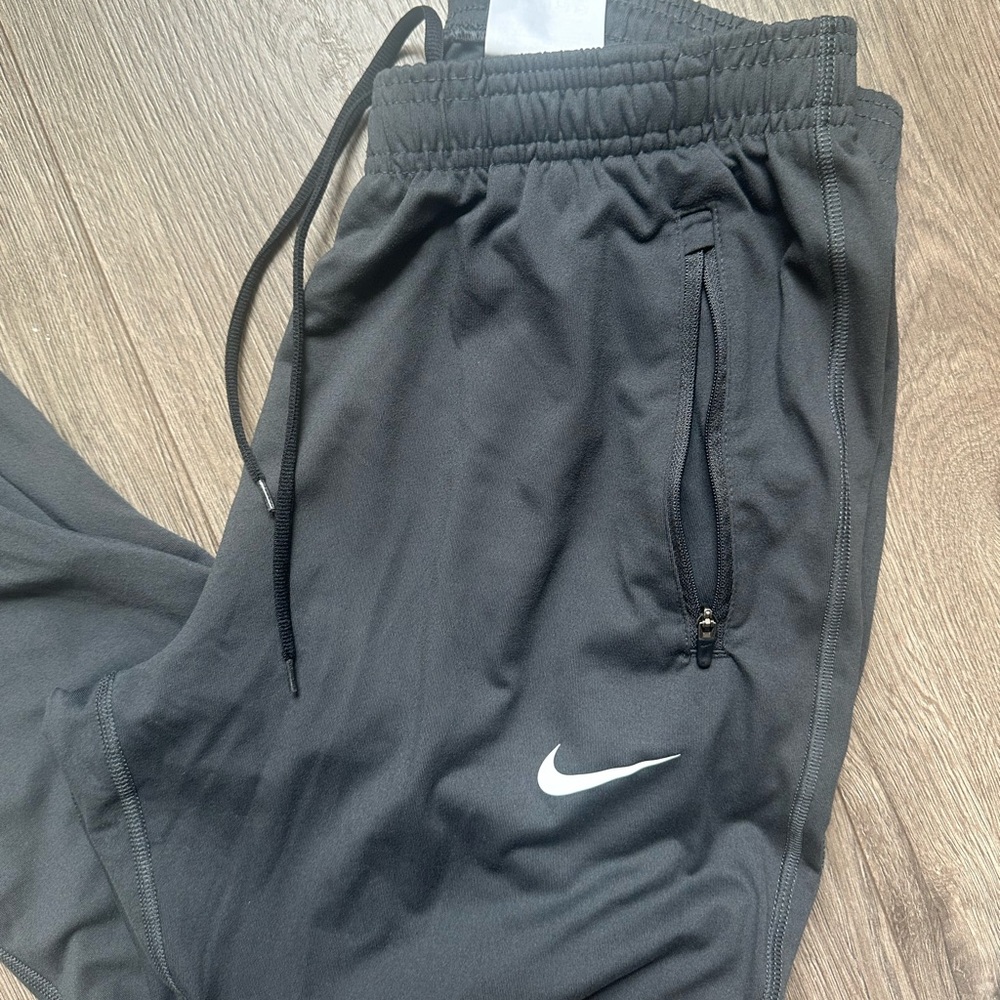 Nike Dri Fit Women's Charcoal Track Joggers with White Swoosh - Picture 7 of 13